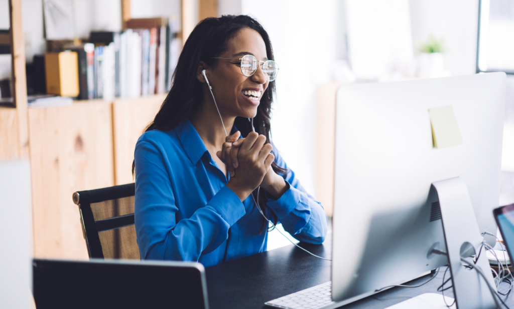 Happy business woman on computer